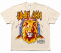 A beige short-sleeve graphic t-shirt featuring a large illustration of a lion with the text 'JUDAH'S LION' and 'GODVESTMENT' printed on the front.
